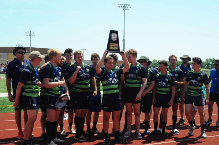 The entire Elmhurst rugby team relishing in their victory of second place in the state championship. 