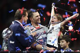 Tom Brady celebrates winning his sixth Super Bowl with his daughter, Vivian, after defeating the Rams 13-3.