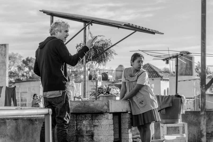 Roma director Alfonso Cuarón directs Yalitza Aparicio in a scene from their film, which, with ten nominations going into Sunday nights ceremony, looks poised to sweep. Photo courtesy of Time Magazine.