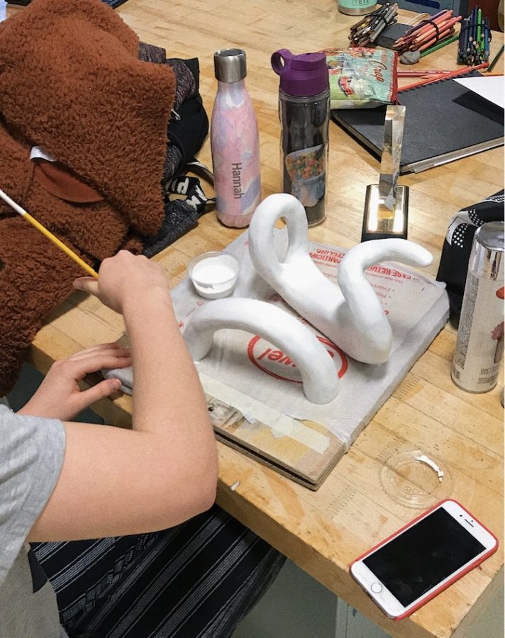 Hannah Graber works on a sculpture in the AP art class.