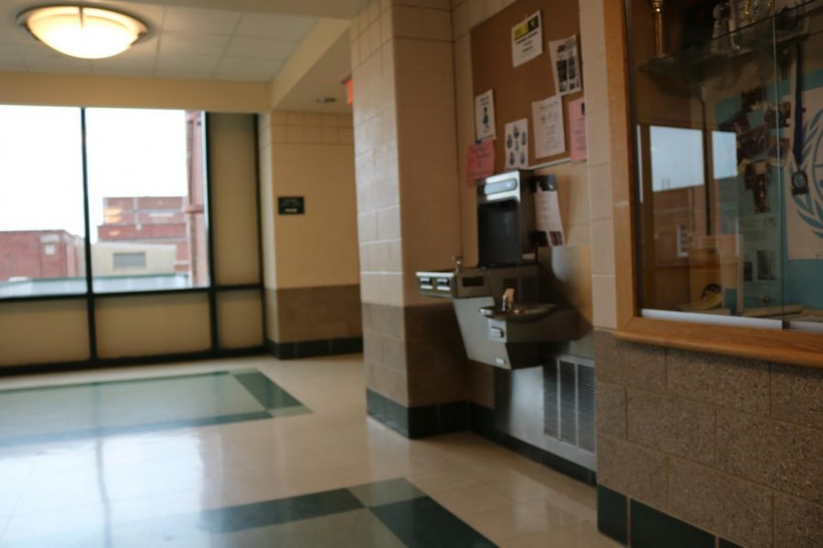 The water fountain and bottle refilling station stands unused in the third floor hallway. 