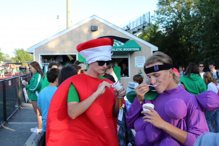 Fruit of the Duke members, Will Ahern (apple) and Jake Hansmann (grape), enjoy chocolate ice cream during the game. 