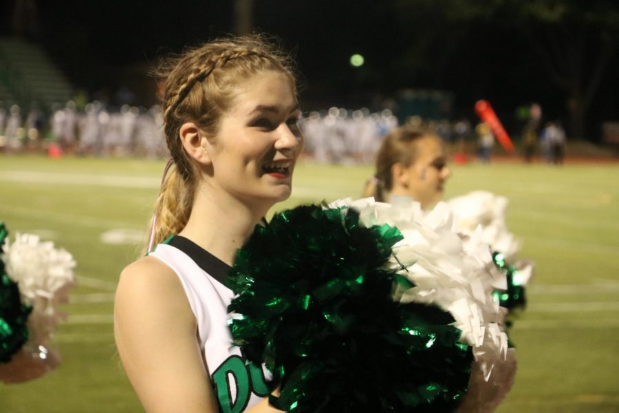 Junior Lillian Marrah helps lead the crowd in a chant during the second quarter of Fridays game. 
