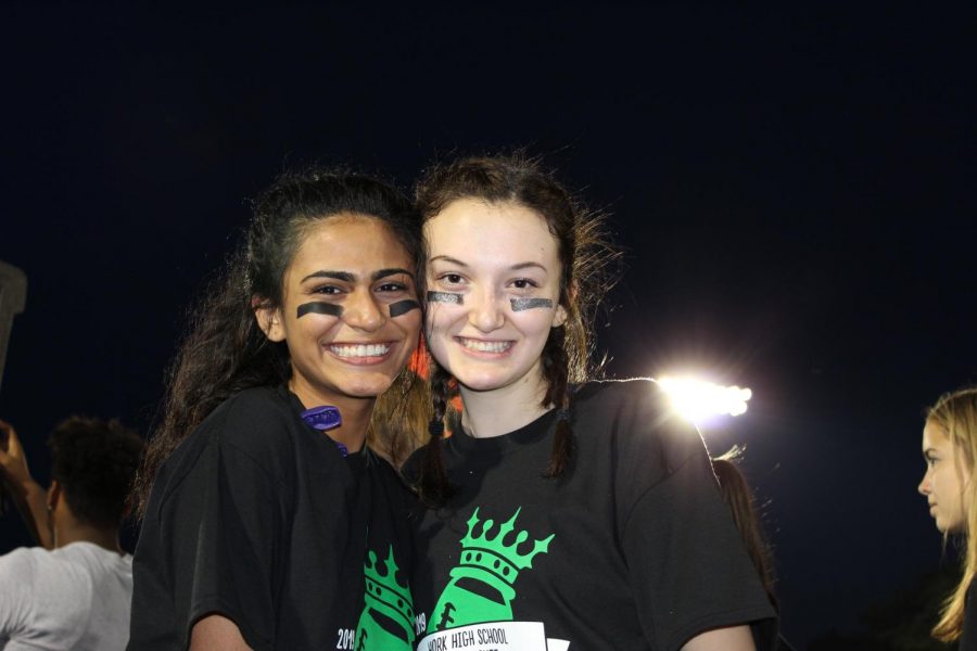Seniors (from left) Nida Ahmed and Erin Quaid pose for a picture on the sidelines.