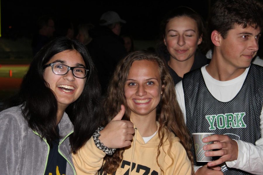Student Council members (from left) Mira Shortt, Taylor Izzo, Maria Chornij and Steve Chornij pass out hot chocolate. 