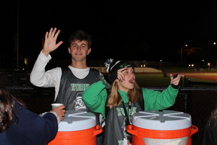 Student Council members Steve Chornij and Murphy McFarlane corral the crowd during hot chocolate distribution.