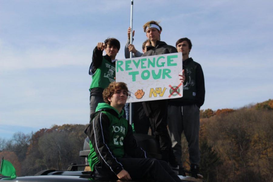 Fans pose with a revenge tour sign at the tailgate. November 9, 2019.