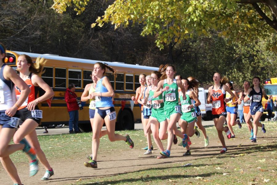 The pack of York runners led by sophomore Katelyn Winton sticks together as they make their way down the home stretch. 
