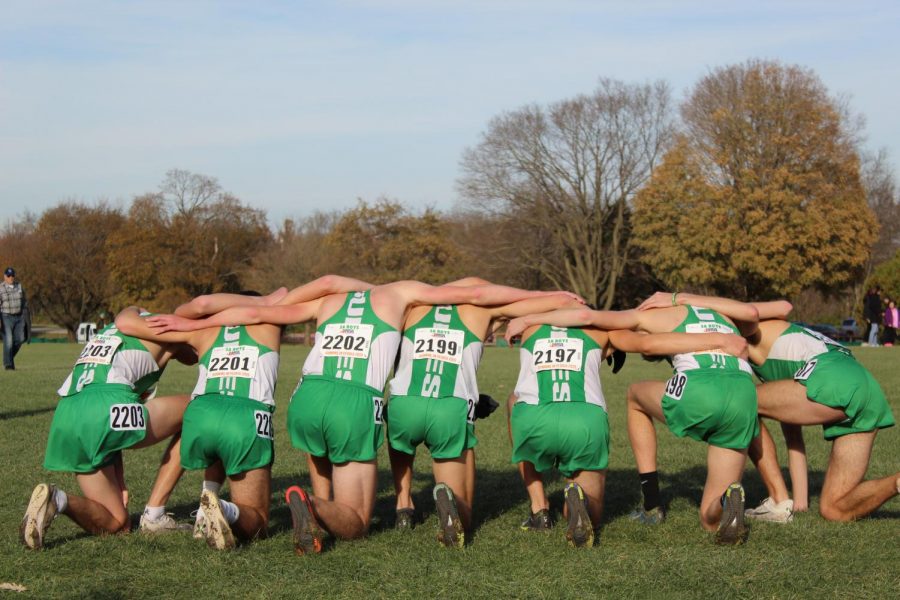 The varsity boys get together to say a prayer after running their race. November 9, 2019.