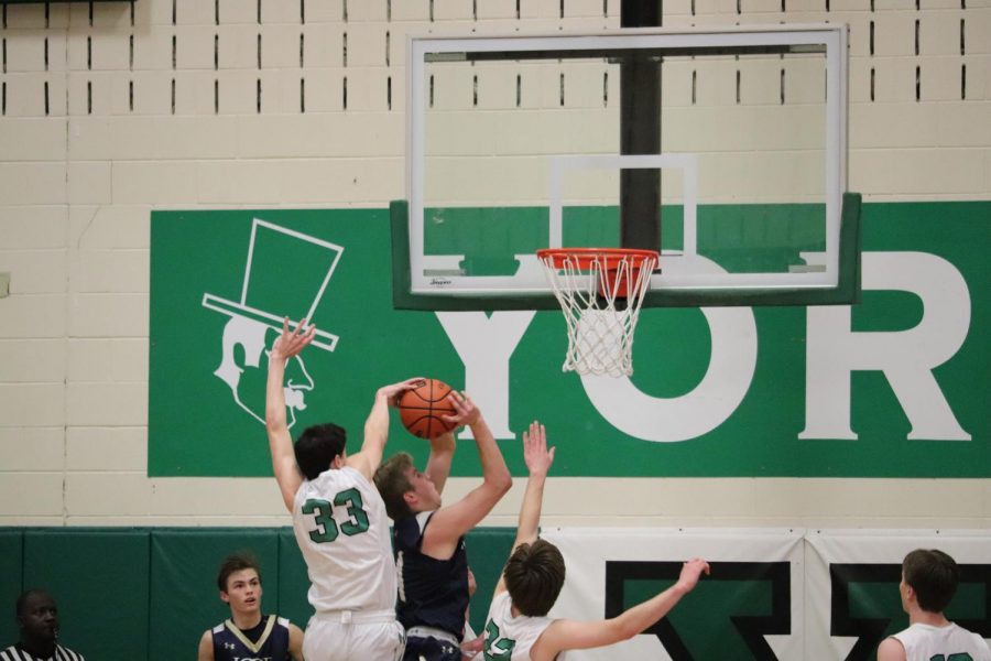 Sophomore Nick Hesch tallies a block to prevent an easy score for ICCP.
