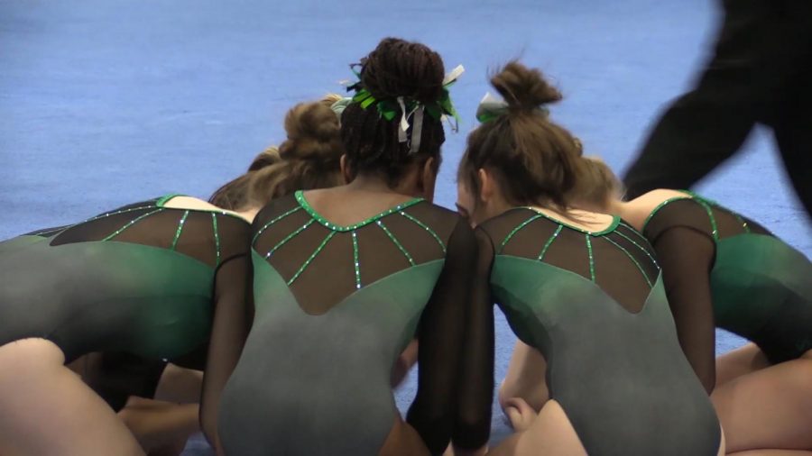 Gymnasts prepare for annual York Invite with their ritual chant. 