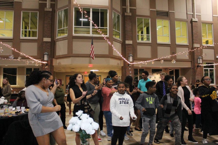 Attendees of the dinner gather to partake in an extremely competitive dance contest. Photo courtesy of Maddy McGreal. 