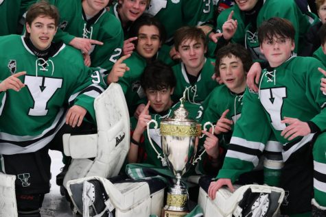 The team crowds around the SHL trophy in eccentric spirit; however, the season is not over yet. Were always hungry for more, Head Coach Matt Boeing said. Were going to keep playing like were chasing a state championship because we are. 