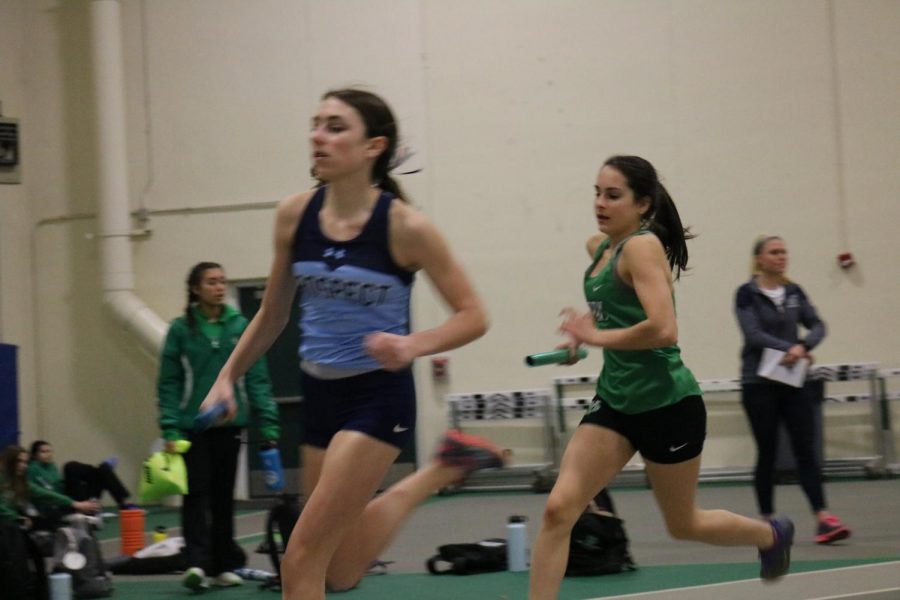 Sophomore Katelyn Leonard chases down competitors in the frosh/soph 4X800m relay to get her team into a top spot.