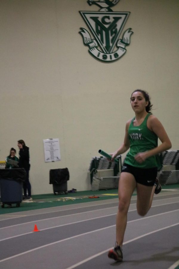 Sophomore Allison Fitzgibbons races past as she maintains her teams first-place position in the frosh/soph 4X800m relay.