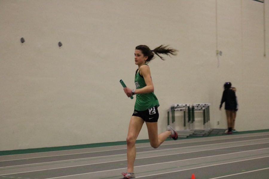 Freshman Brooke Berger sprints into the finish line as she anchors the frosh/soph 4X800m relay. The team finished with an incredible 10:04.33.