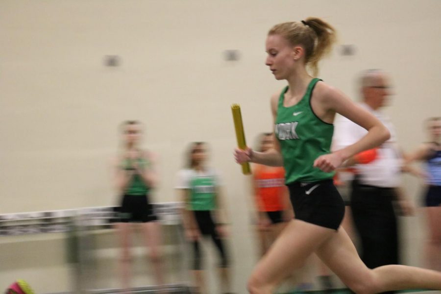 Senior Emma Kern leads the varsity 4X800m relay splitting a 2:29 and helping the team get into a top spot on the track. York Invite #3, March 7, 2020.
