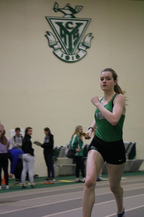 Senior Abby Moriarty competes in the varsity 4X800m relay at the York Invite #3.
