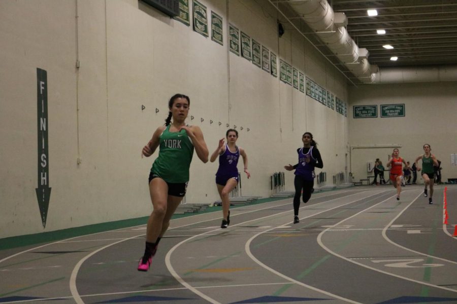 Sophomore Frances Bronson races a personal record of 45.77 in the frosh/soph 300m dash.