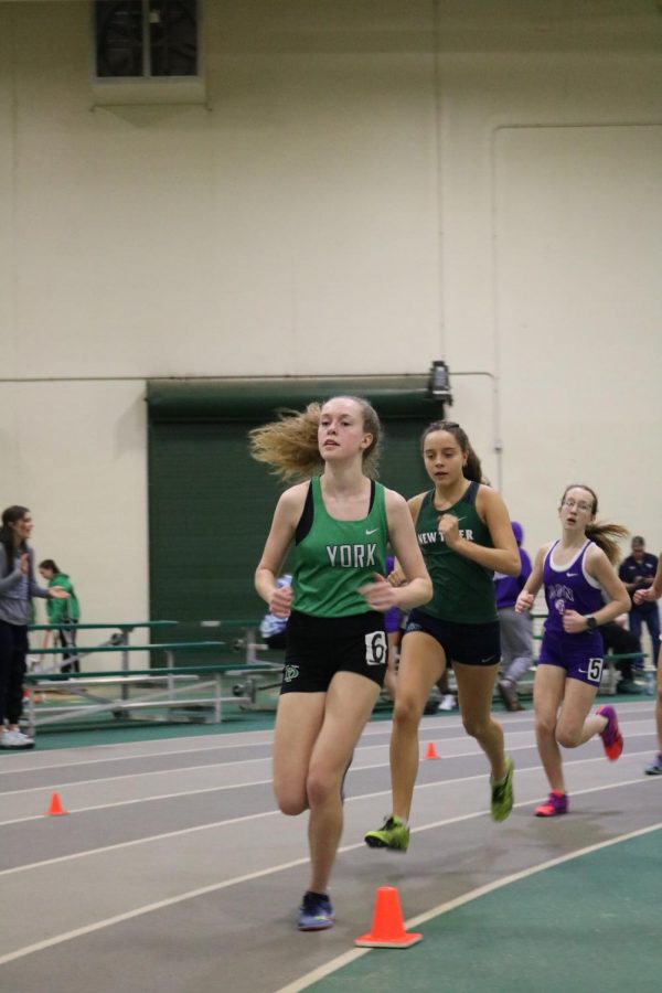 Sophomore Charlotte Reedy races in the 3200m at the York Invite #3. Reedy set a personal record of 12:34.24.