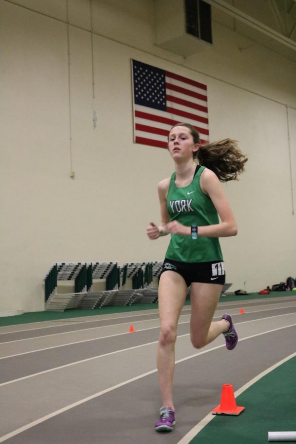Sophomore Shannon Farrow races the 3200m run at the York Invite #3. Farrow raced a personal record of 12:48.71.