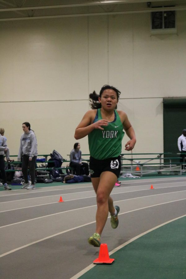 Junior Emily Ebsen races in the 3200m run at the York Invite #3. March 7, 2020.
