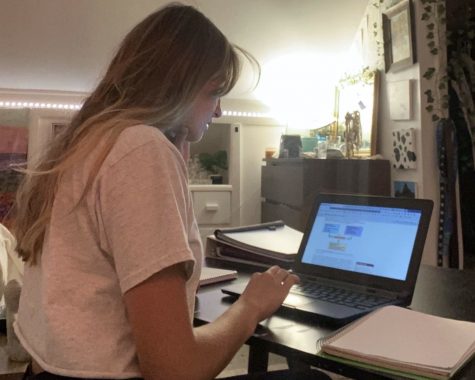 Senior Allie Sidio works on schoolwork asynchronously from the comfort of her home. 