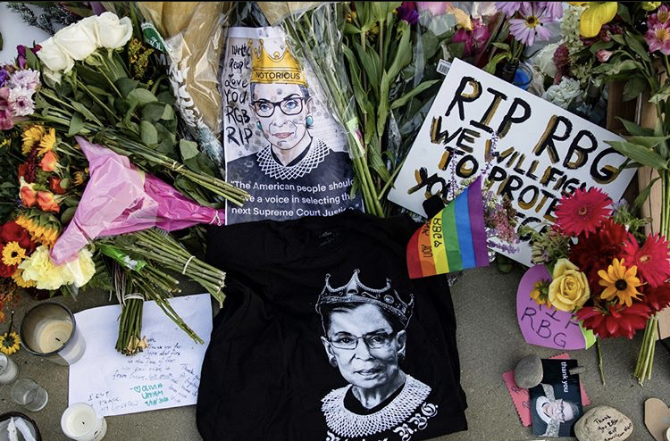 Mourners gather outside of the Supreme Court following the death of Justice Ruth Bader Ginsburg. They left flowers and signs in tribute to the American feminist icon. Ginsburg became the first woman and first Jewish person to lie in state at the United States Capitol. 