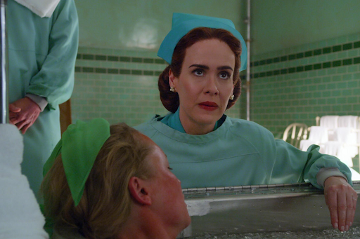 Still of Sarah Paulson, who plays Nurse Mildred Ratched, as she tends to one of her patient’s diagnosis.