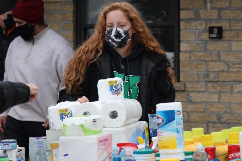 Junior Olivia Holubowicz assisted residents with the home and cleaning supplies. Residents were limited to one detergent along with several other limited products; however, other products were plentiful enough to allow for multiples.