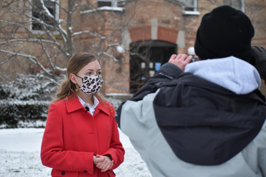 Freshman Noley Hanna prepares for her first take as new reporter Tiffany Edwards in “The Laramie Project”. Students and directors recently began filming outdoors around Elmhurst. The film is set to premiere to the community in the upcoming months. 
