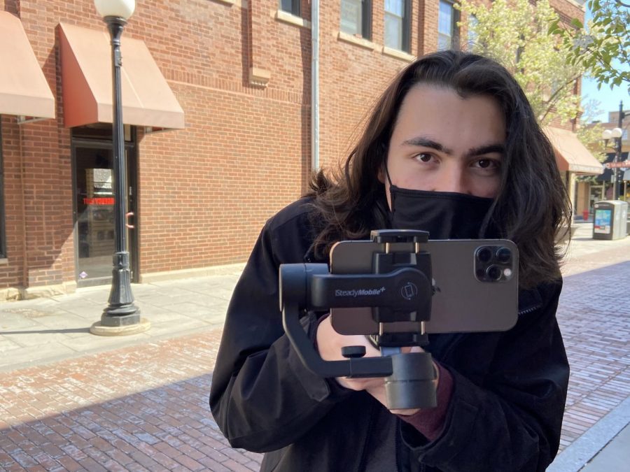 Senior and assistant director of Yorks spring musical in film-form, Charlie Kungl, gets ready for some close up shots on set in downtown Oak Park on April 25. Theory of Relativity will be available on devices near you and your living room starting Friday May 21. 