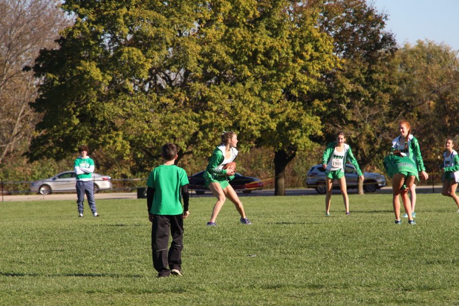 Senior Katelyn Winton makes a catch during a celebratory game of football while waiting for the boys results.  November 6th, 2021