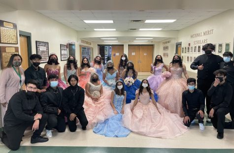 Members of the Hispanos Unidos club showcase traditional quinceañera dresses and perform a cultural dance for all lunch periods. 