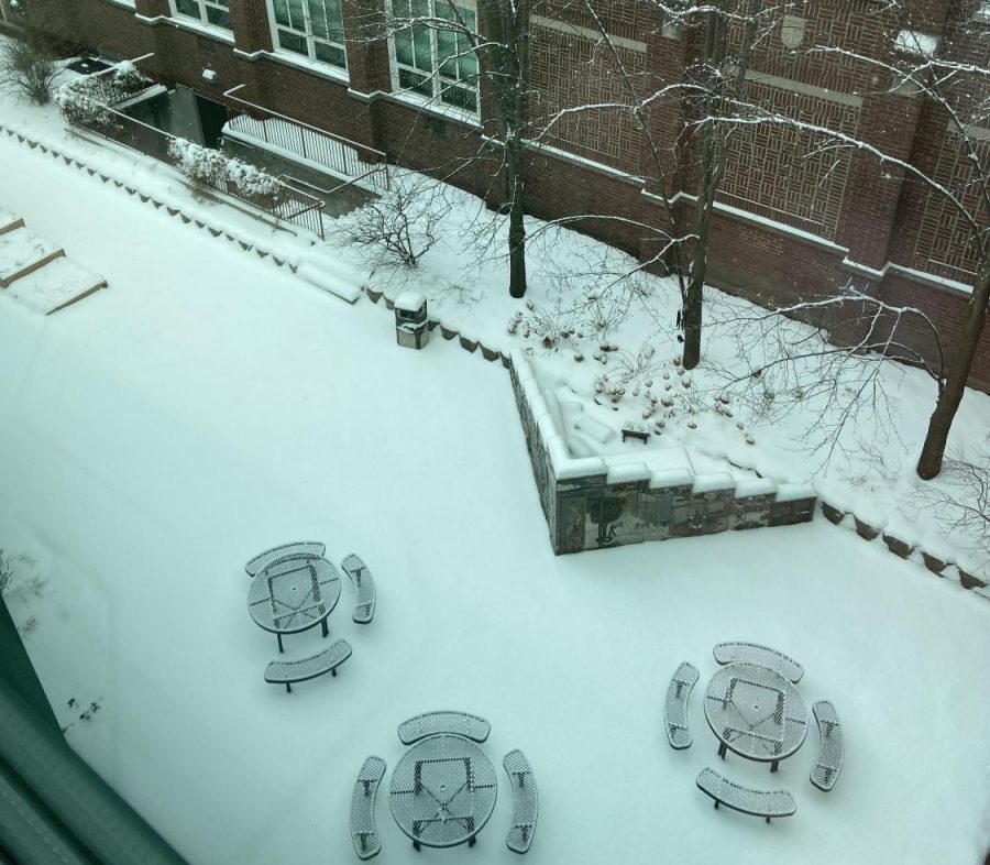 The senior courtyard is blanketed with the freshly fallen snow that gave many students transportation troubles the morning of Monday, January 24. 