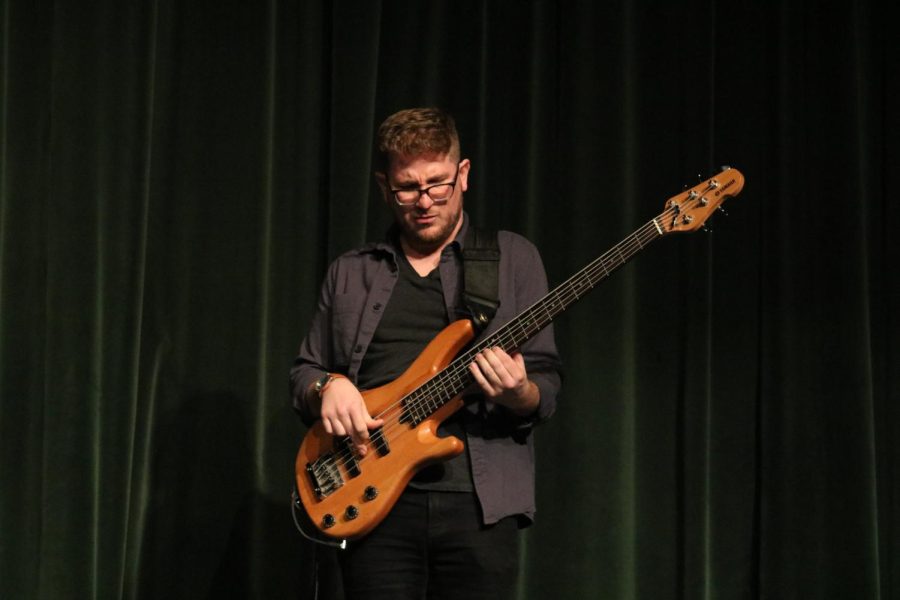 Andrew Bogt plays the bass for the band, Bonzo Squad. 