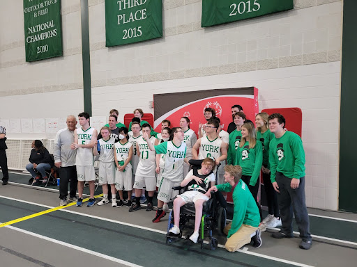 The Special Olympics Basketball team, peer partners and coaches pose for a team photo after a successful season. (Photo courtesy of Steven Westendorf)
