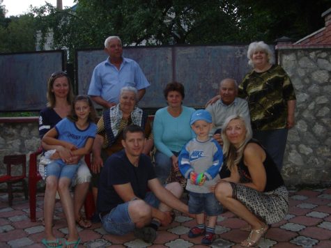 Dennis Sosnovyy visited his family in Ukraine most recently in 2008 where they were able to capture a picture with friends, family, and neighbors.