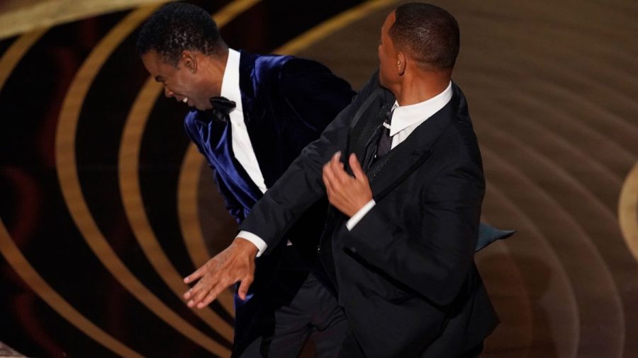Will+Smith+slapping+Chris+Rock+on+stage+at+the+2022+Oscars