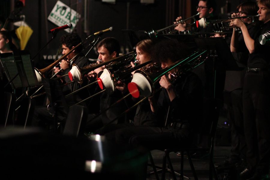 The trombone section of the York Jazz band performs during Fine Arts Week