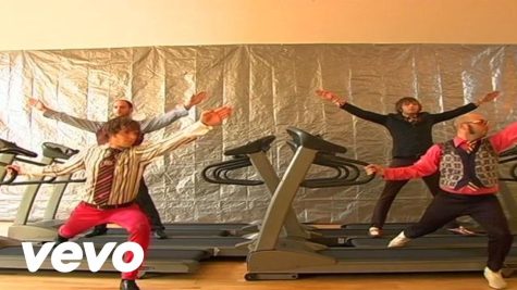 Members of OK Go in their iconic Here it Goes Again music video. Their treadmill choreography has gained 60 million views on YouTube. (Photo courtesy of OK Go on YouTube)