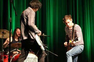 Michael Reinhold (left), Jeff Aquino (middle), and Jon Babin (right) rock out during one of their original songs.