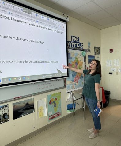 Teacher, Lindsay Wyffels coaches her 8th period class through a french literature analysis.