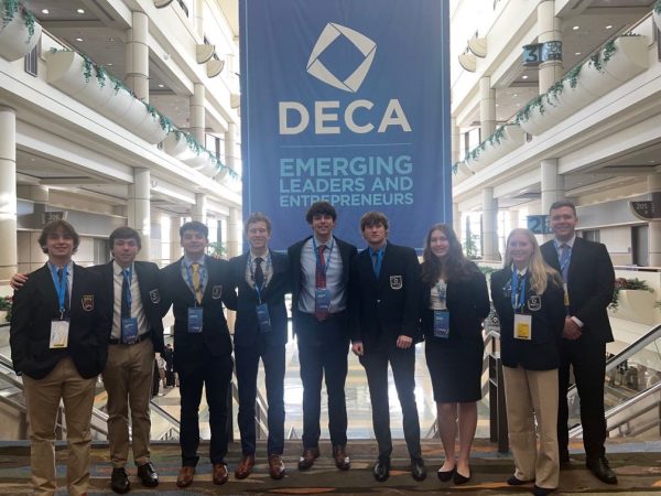 DECA competitors and observers pose at nationals.