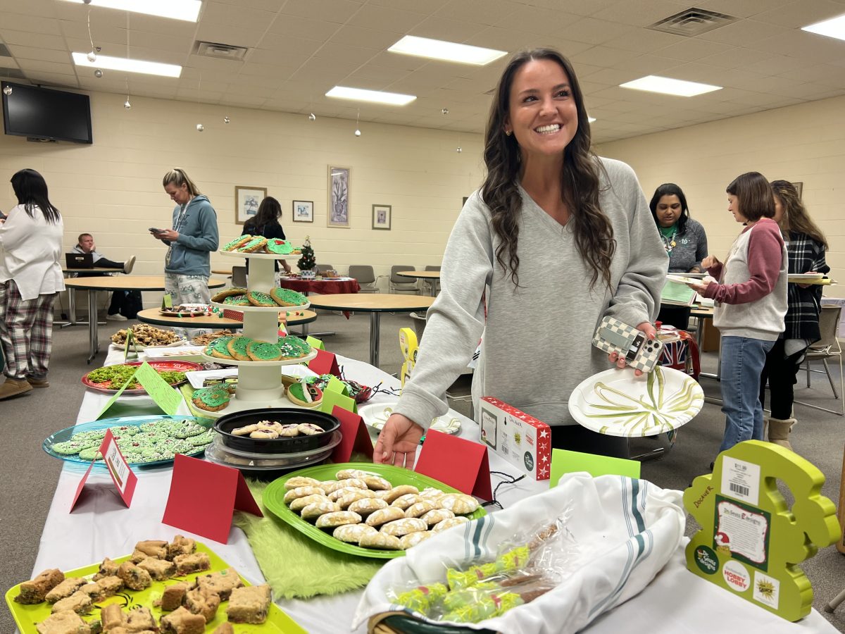 Jenna Callen, family and consumer science teacher, enjoying the special education department’s table of cookies.