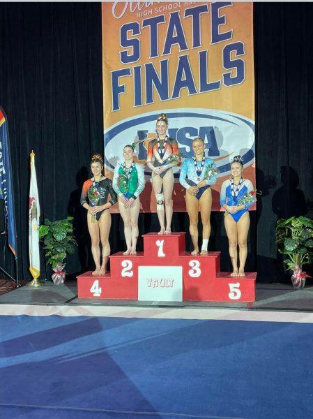 Angela places second in vault after scoring a 9.7, a nearly perfect score.